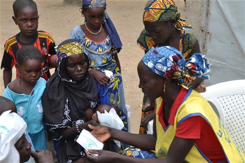 A volunteer nurse teaches people how to properly take their prescriptions during a humanitarian assistance mission led by Cameroonian Soldiers from the Battalion d'Intervention Rapide in Kourgui, Cameroon May 13, 2015.The mission, funded through the U.S. Africa Command Humanitarian and Civic Assistance Program, provided medical assistance and education to more than 1,250 people displaced due to Boko Haram violence.