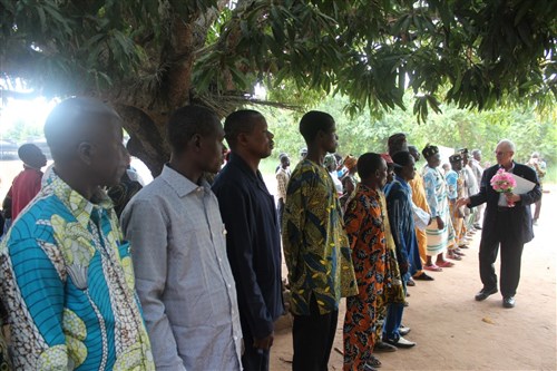 Ambassador Robert E. Whitehead greets community leaders and parents of children who will attend a new primary school in Atomé, Togo, May 28, 2015. U.S. Africa Command funded construction of the school through the Humanitarian and Civic Assistance Program. Photo by Ben Simyeli, U.S. Embassy Lomé.

