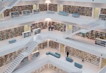 Books on shelves in multi-level library (Shutterstock)