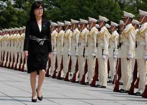 Tomomi Inada reviewing troops in formation (© AP Images)