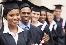 Row of students in graduation caps and gowns (Thinkstock)