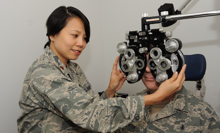 Ophthamologist Air Force Maj. Thuy Tran evaluates a patient during an eye exam. (U.S. Air Force photo by Tech. Sgt. John Hughel)