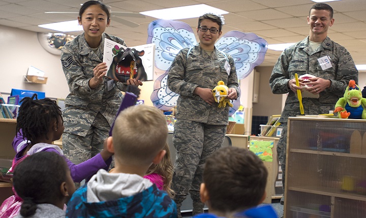 From left, Air Force Staff Sgt. Soohwa Ono, Senior Airman Vanessa Rivas and Capt. Daniel Chartrand promote pediatric oral hygiene at the Kelly Child Development Center. (U.S. Air Force photo by Staff Sgt. Kevin Iinuma)