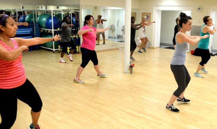 People participate in a Zumba class dance – a Latin-inspired workout that helps burn calories while dancing. 