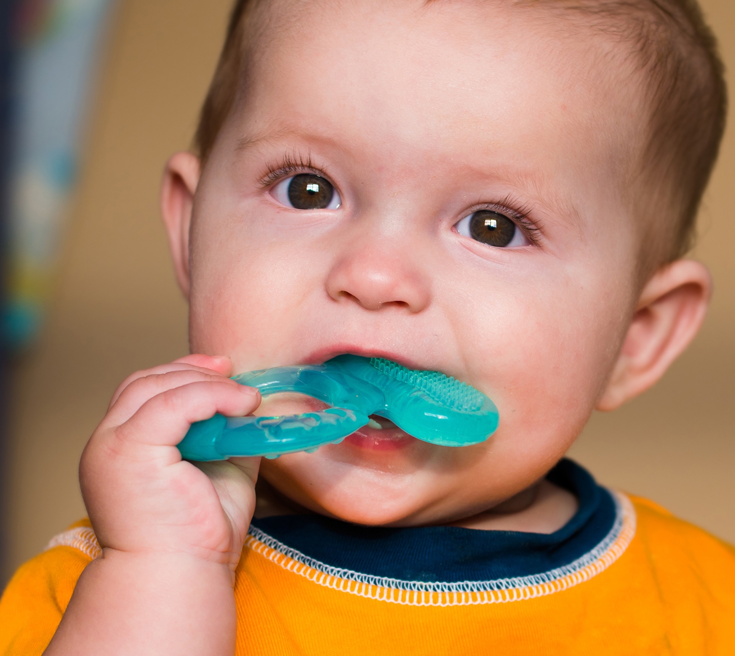 baby with teething ring