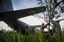 Airmen with the 1st Special Operations Aircraft Maintenance Squadron move a tree to avoid contact with the tail of an AC-130H Spectre on Hurlburt Field, Fla., Aug. 15, 2015. More than 40 personnel from eight base organizations were on site during the tow process. The AC-130H will be displayed at the north end of the Air Park. (U.S. Air Force photo/Senior Airman Meagan Schutter) 