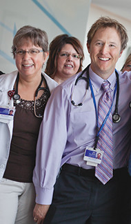 Group of doctors smiling.