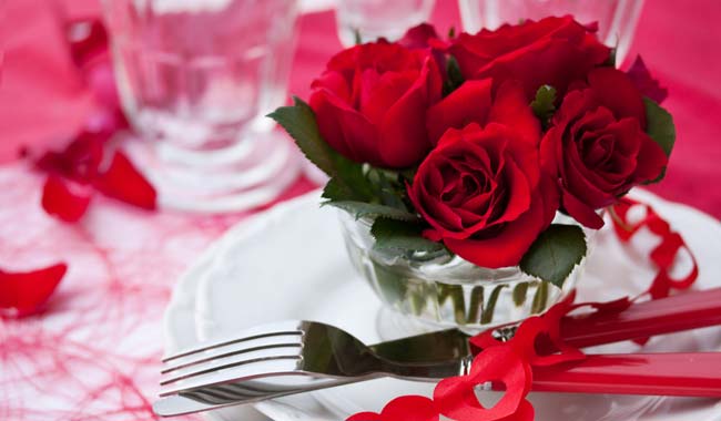 	Red roses on tableware 