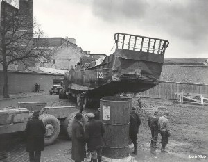 A US Army M-25 tank retriever hauls a LCM landing craft through Maastricht, Holland, en route overland to the banks of the Rhine River in Germany, 5 March 1945. The landing craft were used to ferry Army equipment across the river after the retreating German Army destroyed the bridges.