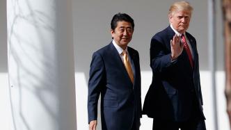 President Donald Trump walks with Japanese Prime Minister Shinzo Abe to a news conference at the White House.