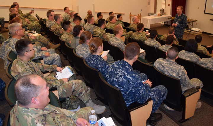 Navy Capt. David K. Weiss, commander of Naval Hospital Bremerton, welcomes dental officers from the Army, Navy and Air Force at the first Puget Sound Military Health System Dental Leadership Symposium. (U.S. Navy photo by Douglas Stutz)