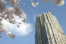 Photo of a high-rise building against blue sky.