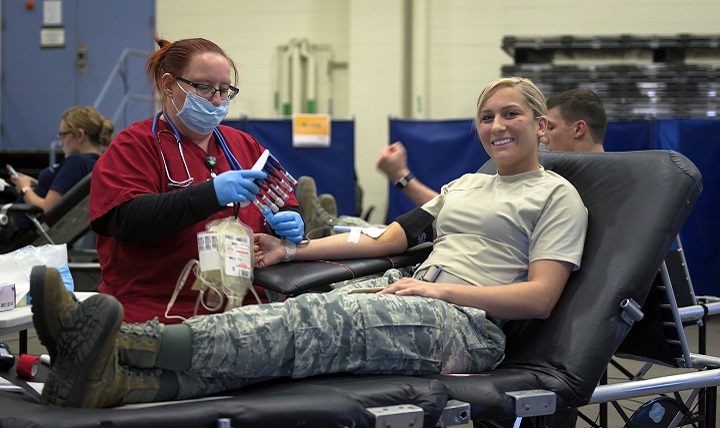 Air Force Senior Airman Hailey McFall, a fuels journeyman with the 182nd Logistics Readiness Squadron, Illinois Air National Guard, donates blood in Peoria, Ill. (U.S. Air Force photo by Tech. Sgt. Lealan Buehrer)