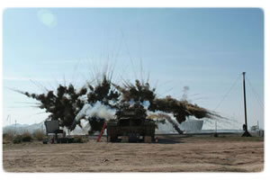 A 4-round half salvo of GALIX 13 grenades is launched from the Center for Countermeasures’ M-60 tank during testing.