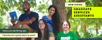 four smiling people sitting near a tree