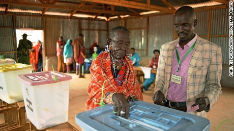 An elderly Maasai lady votes at a polling station in Saikeri, Kajiado West County on August 8, 2017. 
Kenyans began voting in general elections headlined by a too-close-to-call battle between incumbent Uhuru Kenyatta and his rival Raila Odinga that has sent tensions soaring in east Africa&#39;s richest economy.  / AFP PHOTO / CARL DE SOUZA        (Photo credit should read CARL DE SOUZA/AFP/Getty Images)