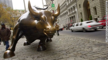 382055 03: A bronze sculpture of a bull is displayed on Broadway in the financial district November 14, 2000 in New York City. The sculpture began as a practical joke by Italian sculptor Arturo di Modica, who originally placed it in front of the New York Stock Exchange building in the middle of the night. The NYSE promptly removed the bull and eventually placed it on Broadway. (Photo by Chris Hondros/Newsmakers)