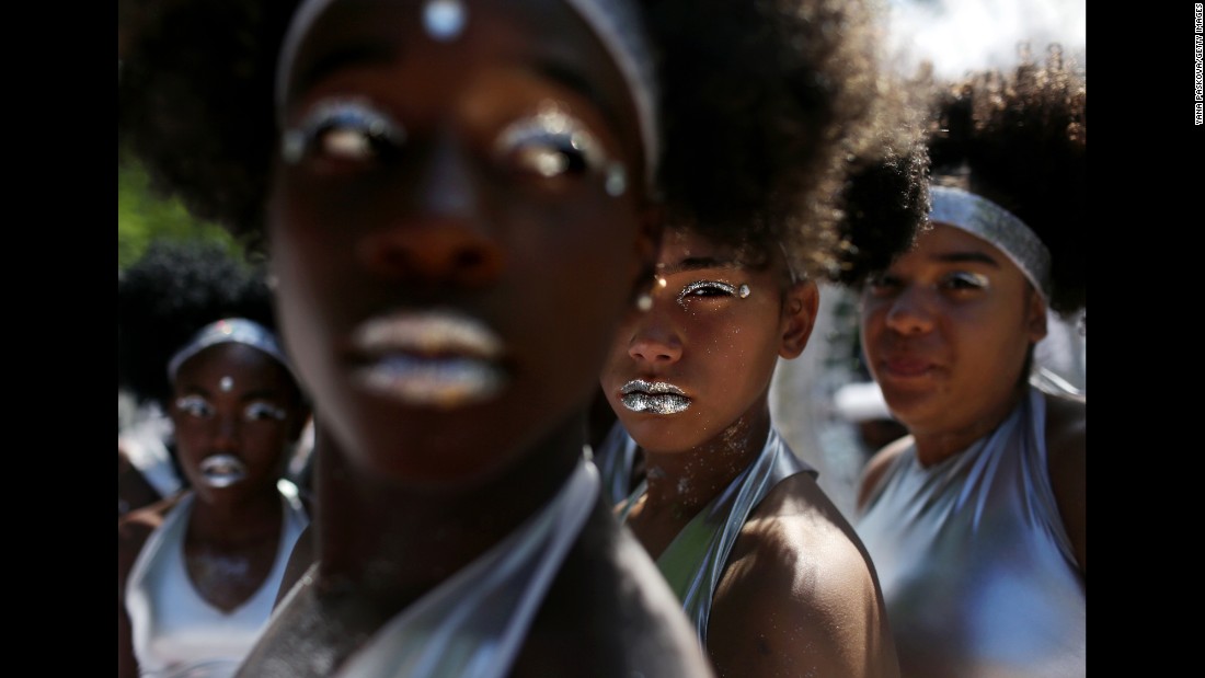 The Visions in Motion dance group prepares to march in New York City for the West Indian American Day Parade on Monday, September 4.