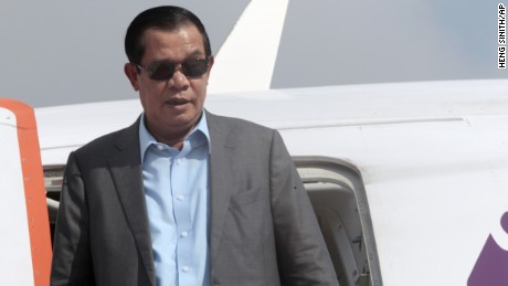 Cambodian Prime Minister Hun Sen exits the plane as his arrives from Laos in Phnom Penh, Cambodia, Saturday, August 12, 2017. Hun Sen, who threatened Friday to use force over a border crisis with neighboring Laos, has announced less than 24 hours later that he has peacefully resolved it. 