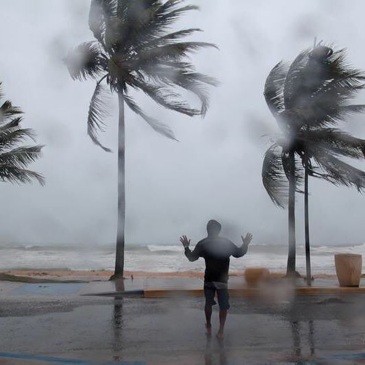 A man reacts in the winds and rain as Hurricane Irma slammed across islands in the northern Caribbean on Wednesday, in Luquillo, Puerto Rico September 6, 2017. REUTERS/Alvin Baez #irma #hurricaneirma #puertorico #weather #wind #reuters #reutersphotos