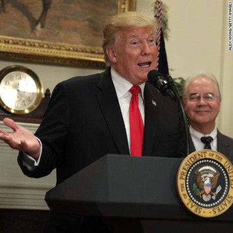 President Donald Trump, with Secretary of Health and Human Services Tom Price looking on, makes an announcement regarding a pharmaceutical glass packaging initiative July 20, 2017 at the Roosevelt Room of the White House in Washington, DC.