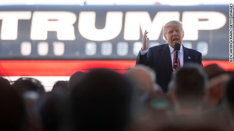 Republican Presidential candidate Donald Trump bashes Republican rival Marco Rubio as he talks to supporters at a campaign rally in an airplane hanger at Northwest Arkansas Regional Airport on February 27, 2016 in Bentonville, Arkansas.