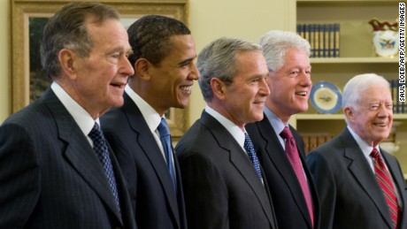 U.S. President George W. Bush, center, stands with President-elect Barack Obama, second left, former President George H.W. Bush third left, former President Bill Clinton, second right and former President Jimmy Carter, right, in the Oval Office of the White House in Washington, D.C., on January 7, 2009. 