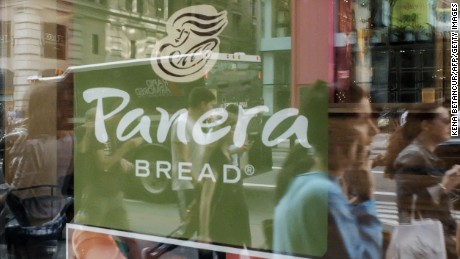 People walk by a Panera Bread restaurant  in Manhattan on September 11, 2015 in New York. AFP PHOTO/KENA BETANCUR        (Photo credit should read KENA BETANCUR/AFP/Getty Images)