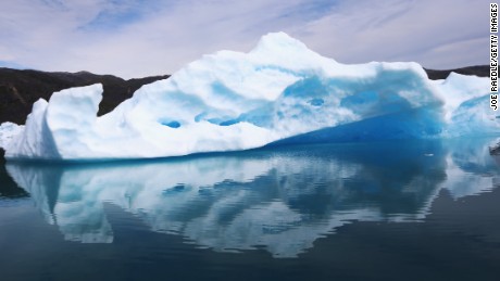 QAQORTOQ, GREENLAND - JULY 30: Calved icebergs from the nearby Twin Glaciers are seen floating on the water on July 30, 2013 in Qaqortoq, Greenland. Boats are a crucial mode of transportation in the country that has few roads. As cities like Miami, New York and other vulnerable spots around the world strategize about how to respond to climate change, many Greenlanders simply do what theyve always done: adapt. 'Were used to change, said Greenlander Pilu Neilsen. 'We learn to adapt to whatever comes. If all the glaciers melt, well just get more land. (Photo by Joe Raedle/Getty Images)