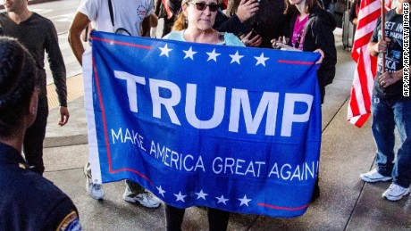 Trump supporters lead a counter-protest of the executive order by US President Donald Trump, banning immigrants from seven majority-Muslim countries at Los Angeles International Airport, California on February 4, 2017.   / AFP / Kyle Grillot        (Photo credit should read KYLE GRILLOT/AFP/Getty Images)