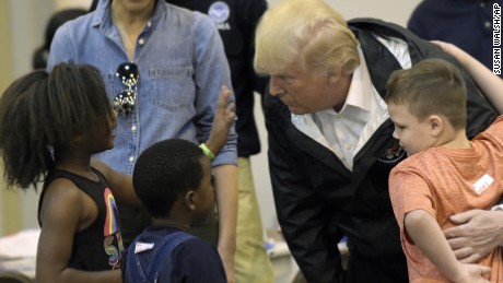 President Donald Trump and Melania Trump meet people impacted by Hurricane Harvey during a visit to the NRG Center in Houston on September 2. 