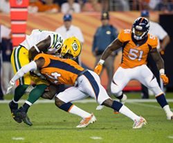 'NFL 2017 - Broncos the Packers 20-17   

Packers RB JAMAL WILLIAMS, left, gets tackled by Broncos S WILL PARKS, center, during the 2nd. Half at Sports Authority Field at Mile High Saturday night. The Broncos beat the Packers 20-17.(Credit Image: © HectorAcevedo / ZUMA PRESS)'