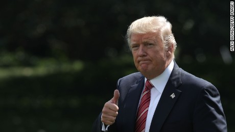 U.S. President Donald Trump gives a thumbs up as he walks towards the Marine One on the South Lawn of the White House prior to a departure August 25, 2017 in Washington, DC. 