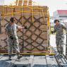 US personnel move cargo scheduled to be delivered to hurricane survivors. (Photo credit: Canadian Department of National Defense)