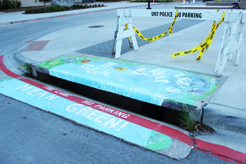 First of three storm drain murals painted on campus to promote sustainability