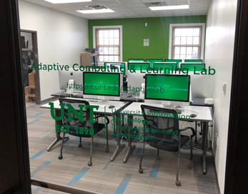 Photo of the Adaptive Computing and Learning Lab as seen through the glass front door.