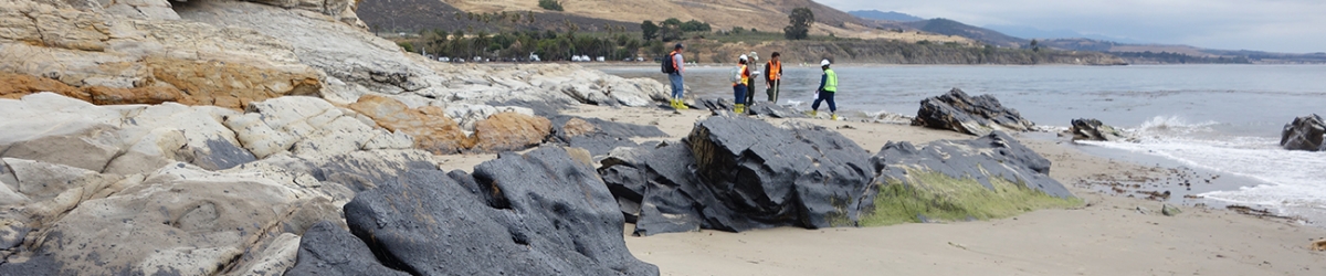 People on a rocky beach.