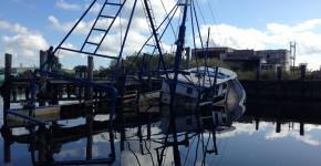 A partially-submerged abandoned and derelict vessel.