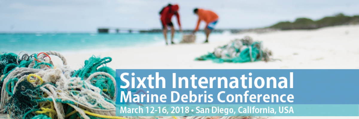 People cleaning derelict fishing gear from a beach. (Photo Credit: NOAA)