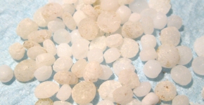 Plastic nurdles spread out on a table