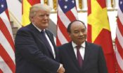 U.S. President Donald Trump, left, shakes hands with Vietnamese Prime Minister Nguyen Xuan Phuc in Hanoi Sunday, Nov. 12, 2017. (Hoang Dinh Nam/Pool Photo via AP)