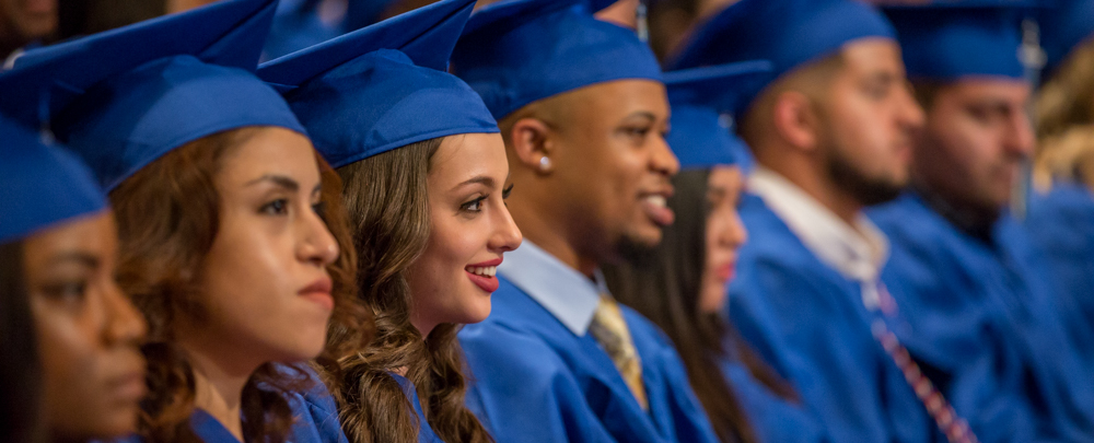 Graduates smiling and looking to the right