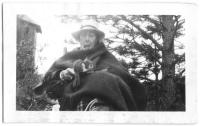 Man feeding squirrel.