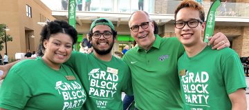 Graduating students with UNT president 