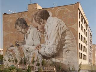 Western artists make history with six-story mural in Tehran