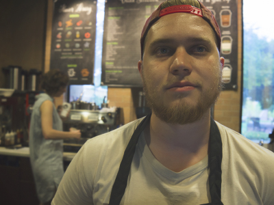 man in a white shirt with apron