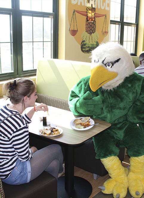 Scrappy Goes Vegan--Scrappy dines with a student in Mean Greens Cafe.