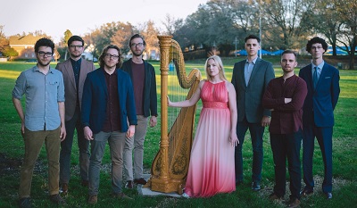 Anna Jalkeus group standing in a grassy field