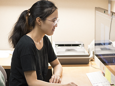 person looking at a computer monitor