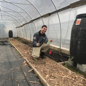 Randy Alghawi working in greenhouse